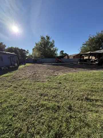 Backyard graded smooth with the Kubota track loader at the back