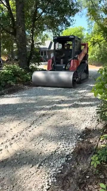 Rolling a new gravel driveway