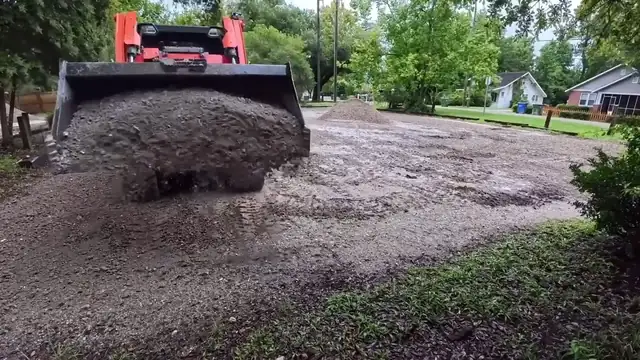 Spreading fill and grading a lot