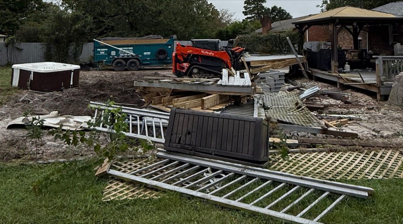 Backyard cleanout in Wilmington, NC: hot tub, deck and fence removal with Kubota skid steer and dump trailer