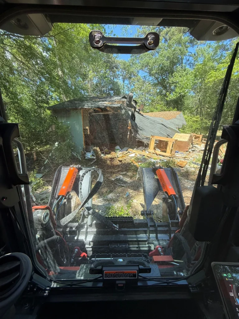 Shed and structure demolition with an excavator
